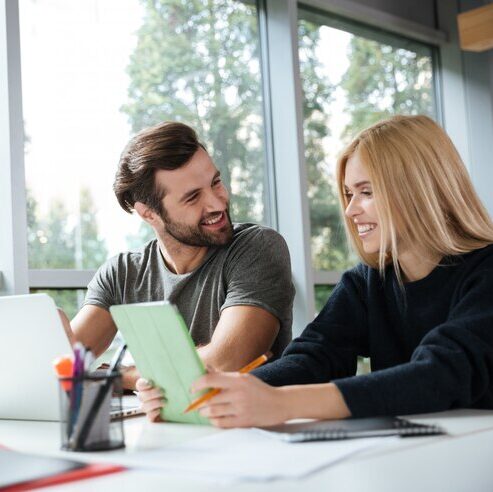 colleagues-sitting-office-coworking_girl_and_boy